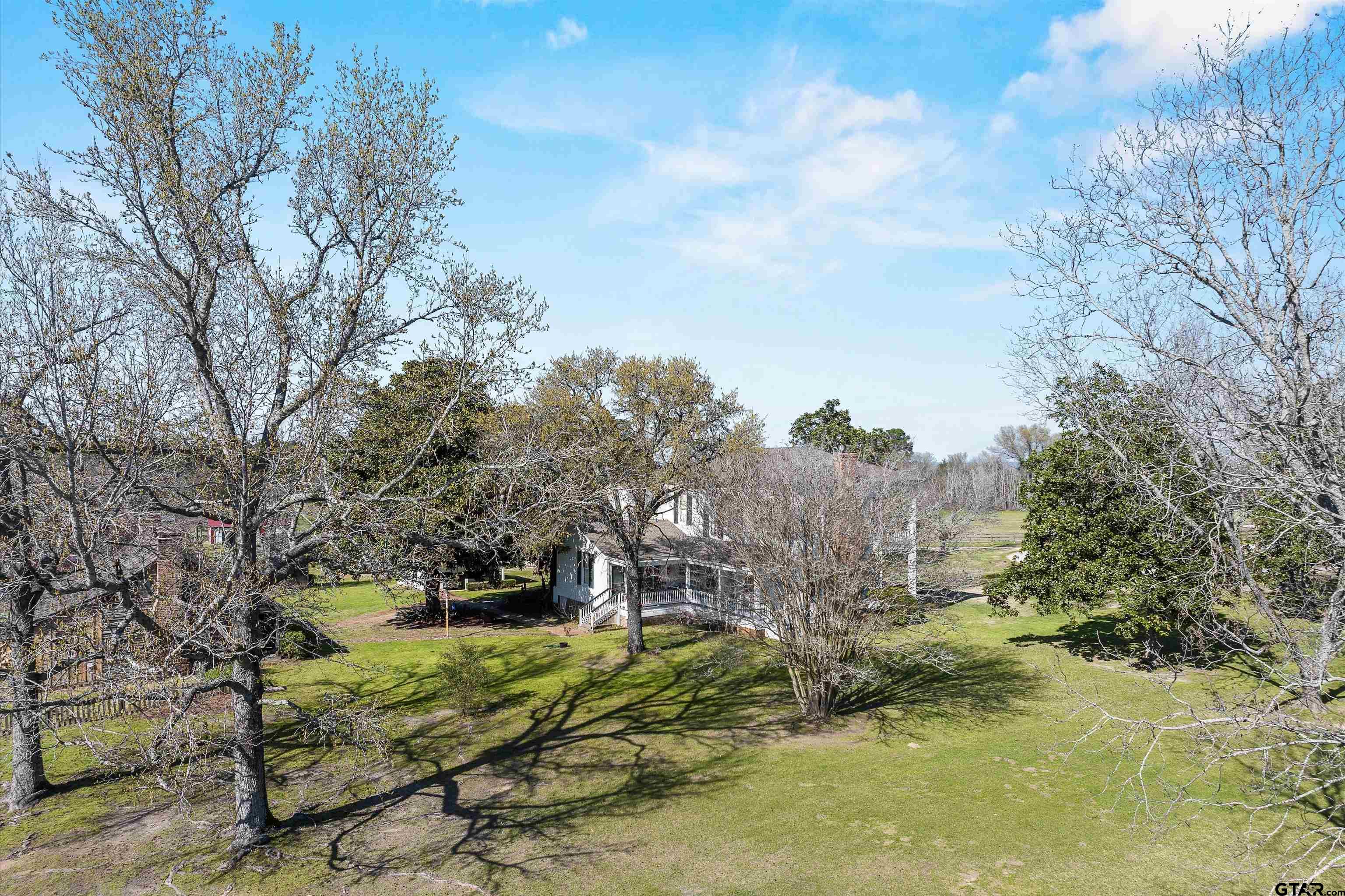 11992 County Road 4233 Cushing, TX 75760 - Photo 40 of 48 a view of a yard with plants and large trees