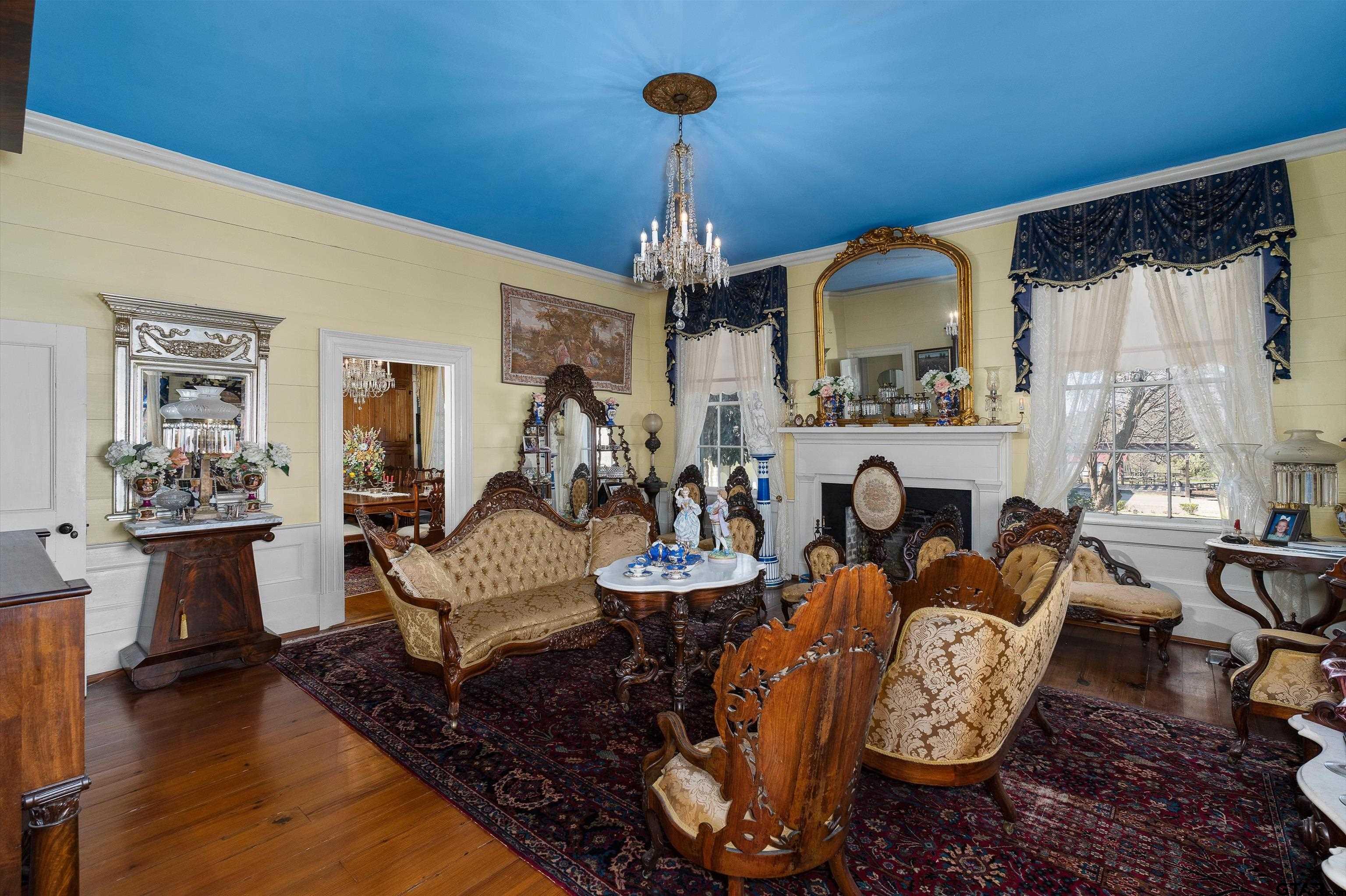 11992 County Road 4233 Cushing, TX 75760 - Photo 6 of 48 a living room with fireplace furniture and a chandelier