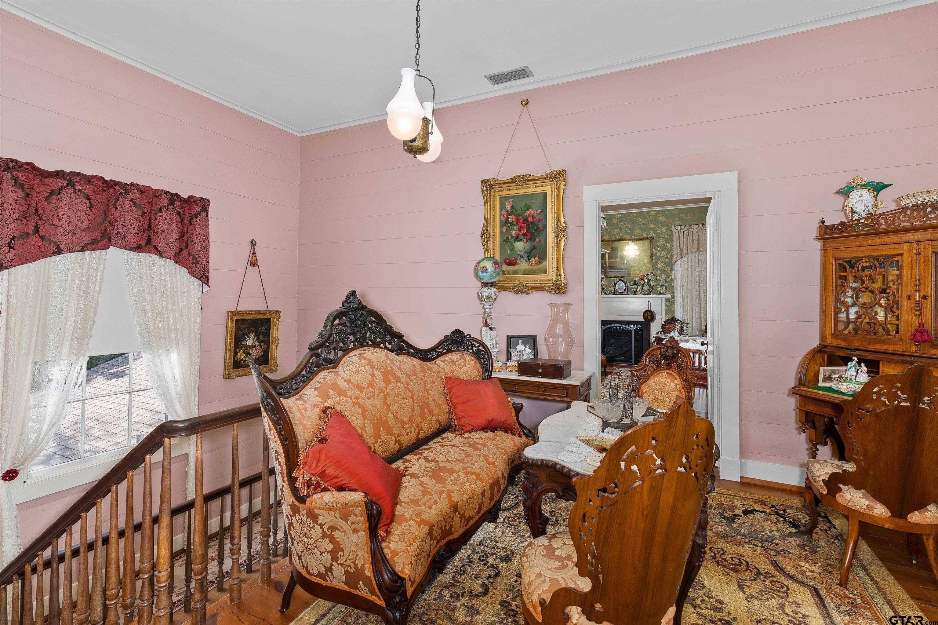 11992 County Road 4233 Cushing, TX 75760 - Photo 10 of 48 a living room with furniture a chandelier and a flat screen tv