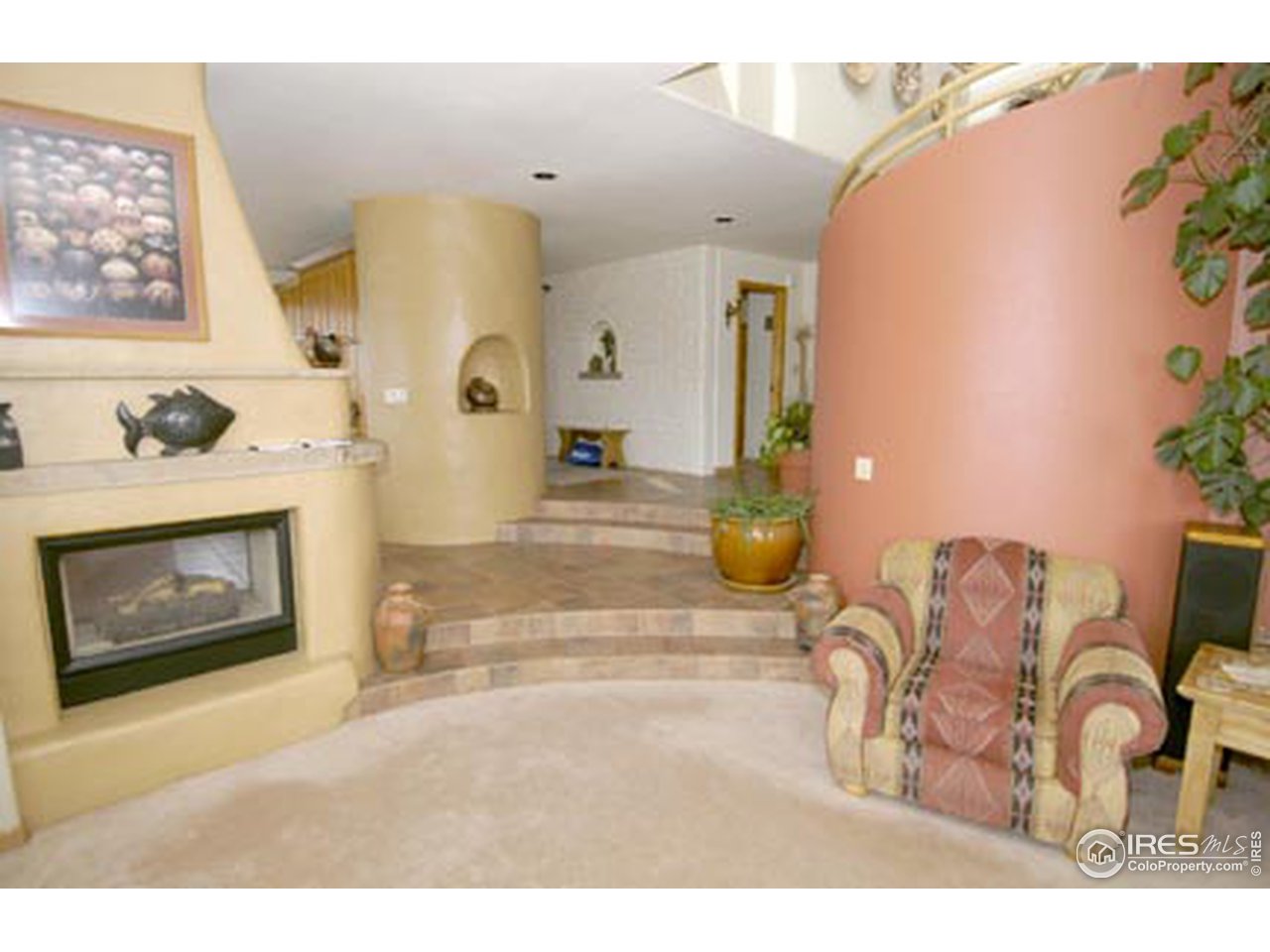 580 Eagle Ridge Road Longmont, CO 80503 - Photo 2 of 12 a living room with furniture and a fireplace
