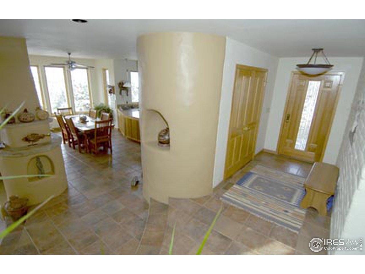 580 Eagle Ridge Road Longmont, CO 80503 - Photo 6 of 12 a living room with furniture and a dining table