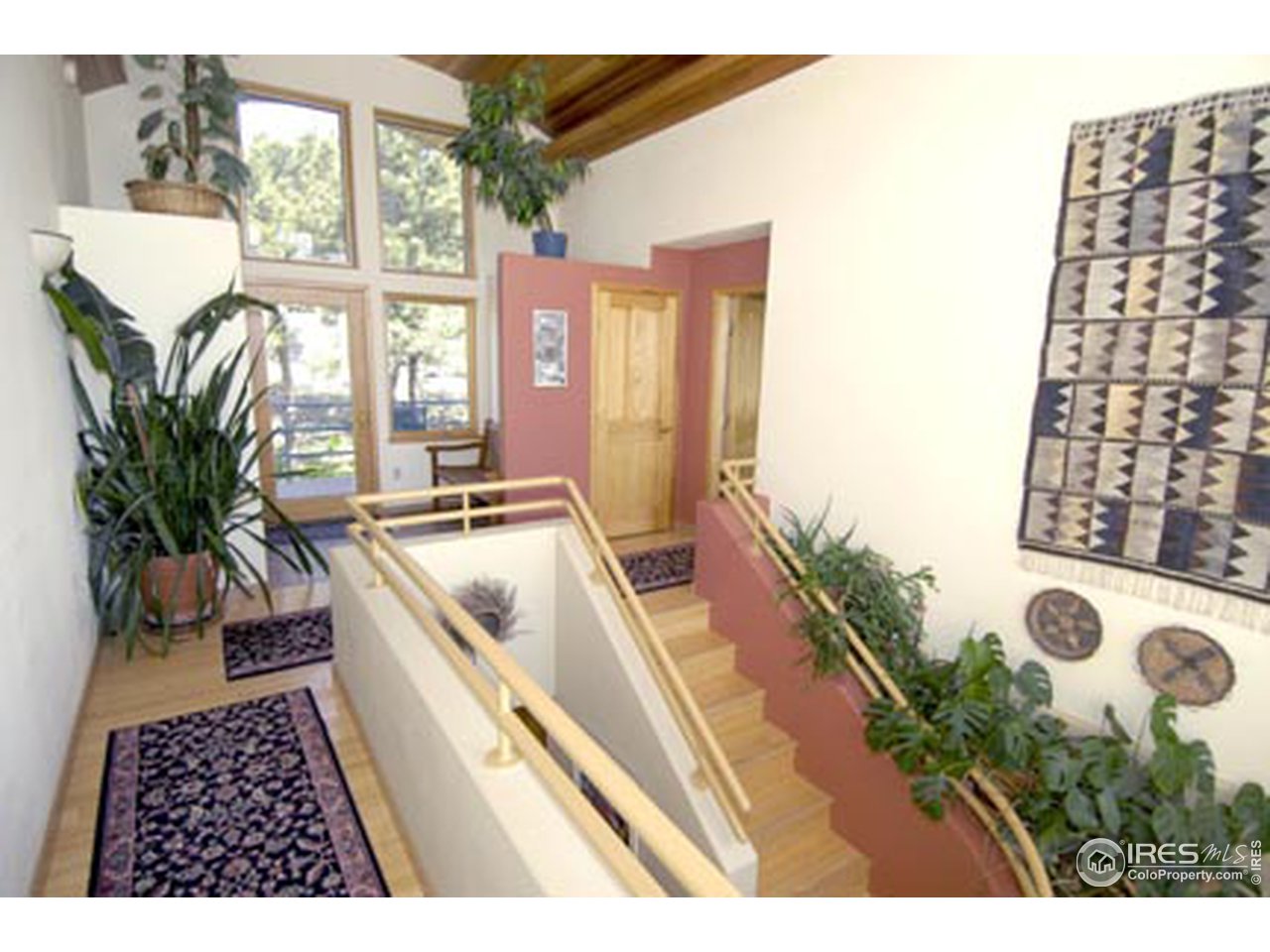 580 Eagle Ridge Road Longmont, CO 80503 - Photo 7 of 12 a living room with a couch and a potted plant