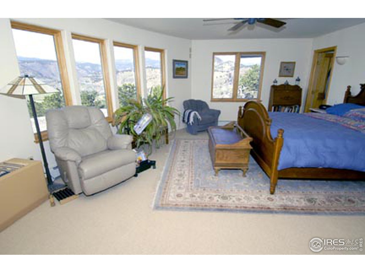 580 Eagle Ridge Road Longmont, CO 80503 - Photo 8 of 12 a living room with furniture rug and a large window