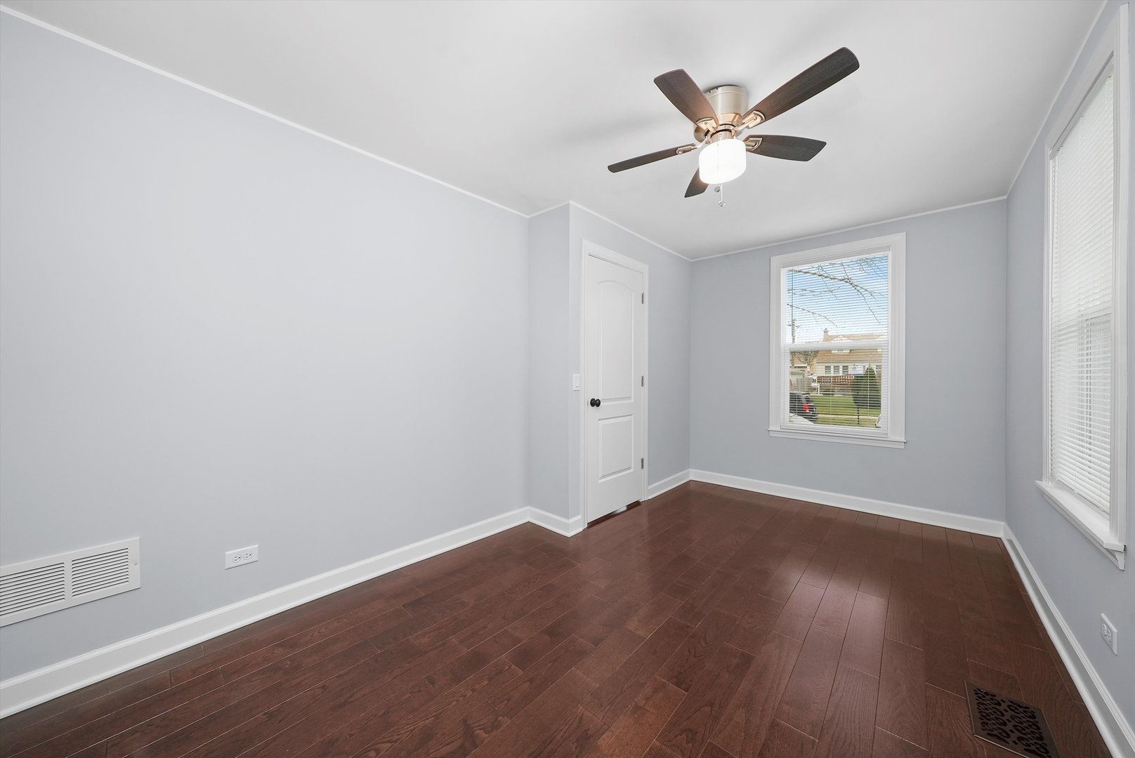 Undisclosed Address Chicago, IL 60656 - Photo 13 of 38 an empty room with wooden floor and ceiling fan