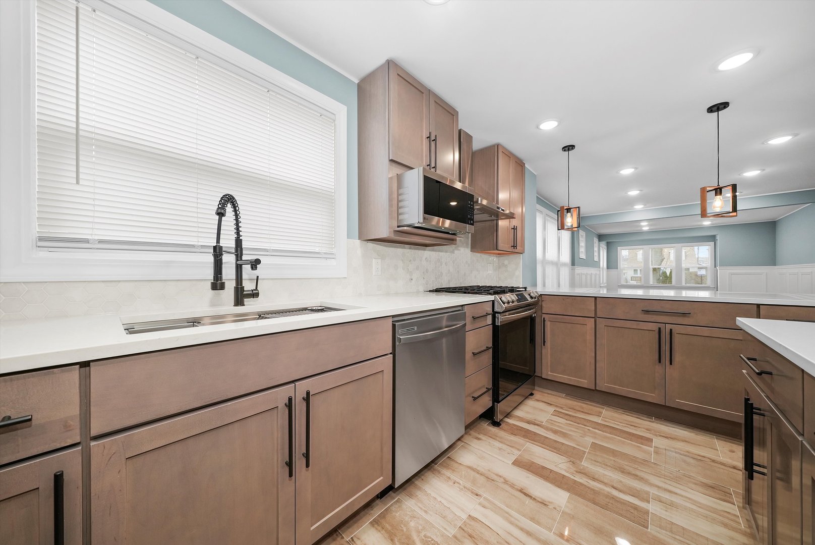 Undisclosed Address Chicago, IL 60656 - Photo 23 of 38 a kitchen with a sink cabinets and appliances