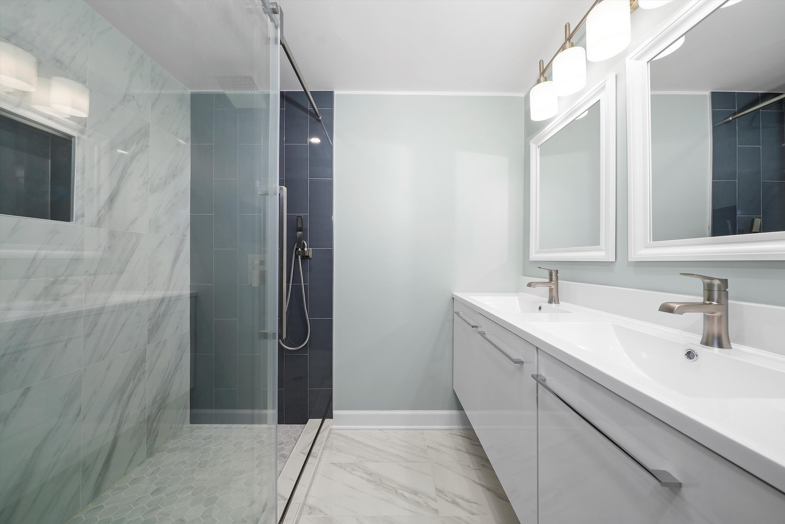 Undisclosed Address Chicago, IL 60656 - Photo 25 of 38 a bathroom with a double vanity sink and mirror