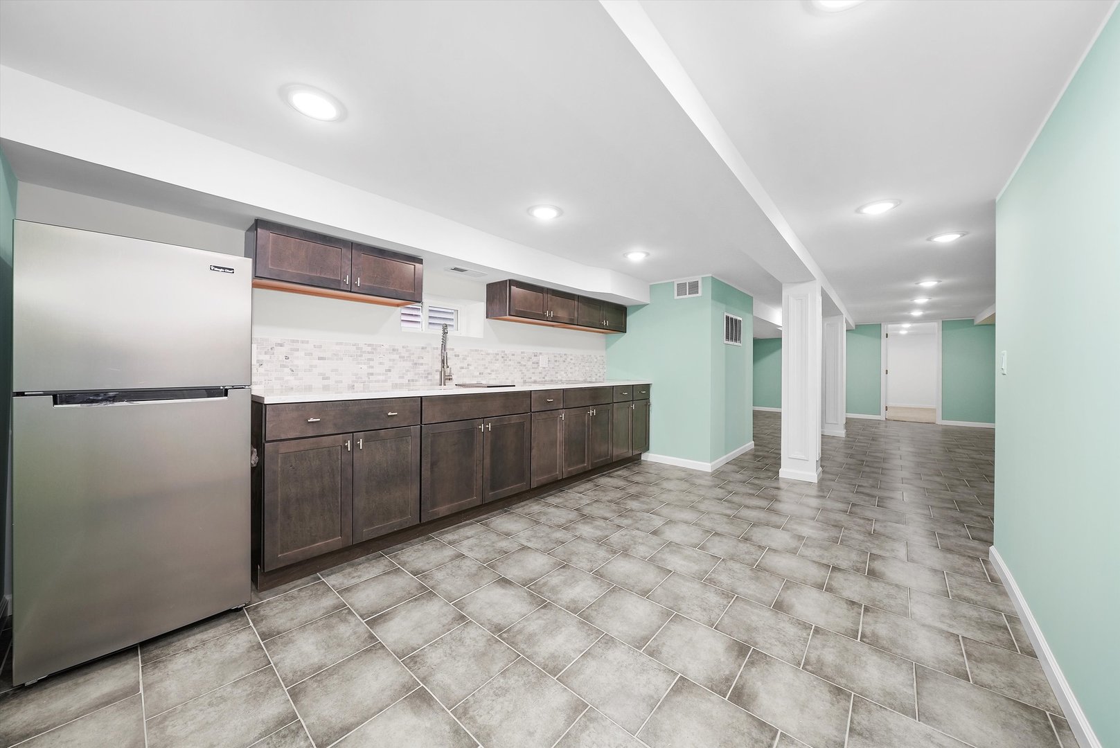 Undisclosed Address Chicago, IL 60656 - Photo 28 of 38 a kitchen with stainless steel appliances a refrigerator and a sink