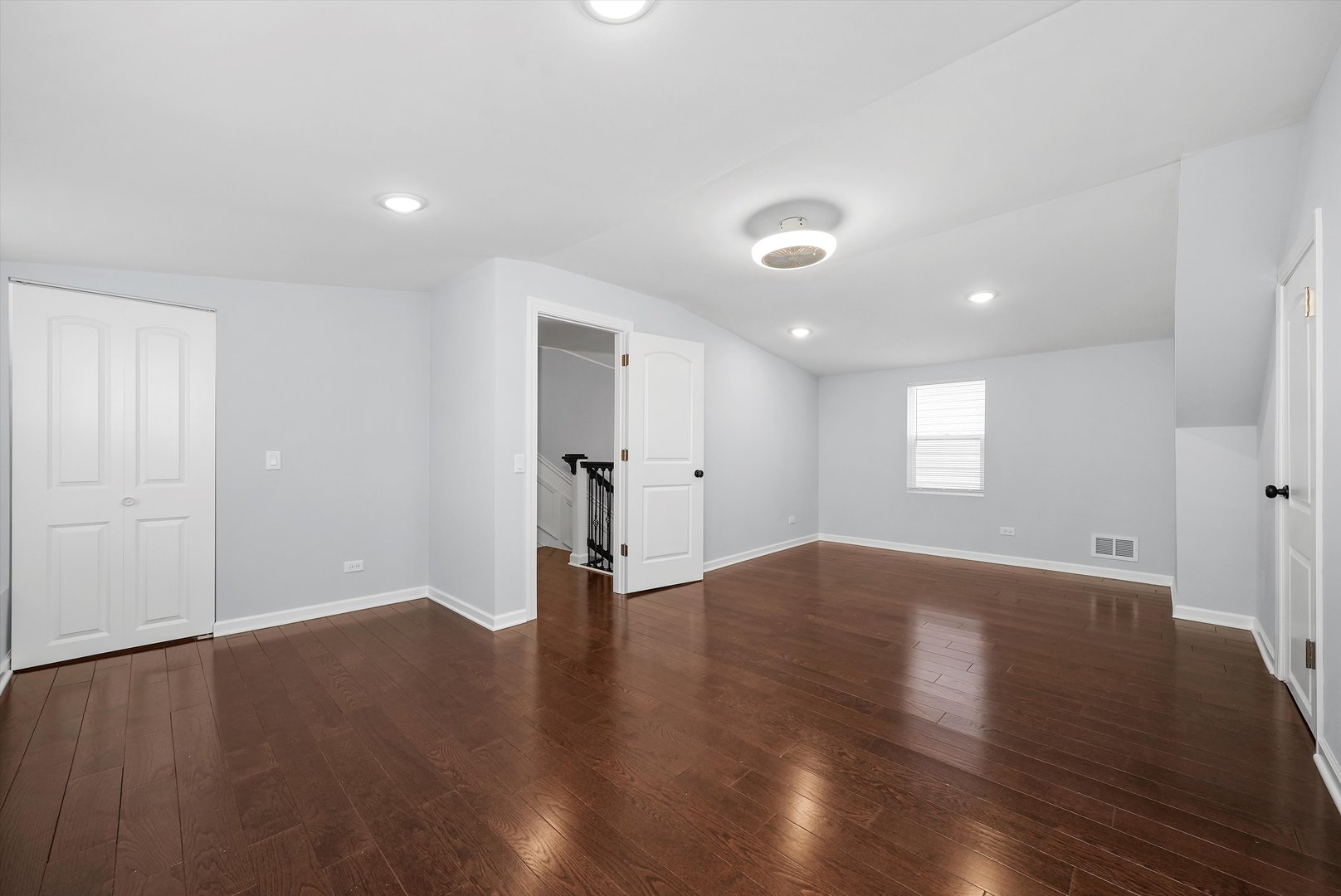 Undisclosed Address Chicago, IL 60656 - Photo 9 of 38 a view of an empty room with wooden floor and a window