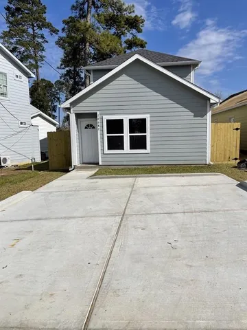 a kitchen with stainless steel appliances kitchen island granite countertop a stove a sink and a microwave
