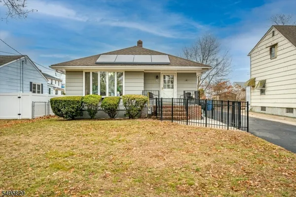 a front view of a house with a outdoor space