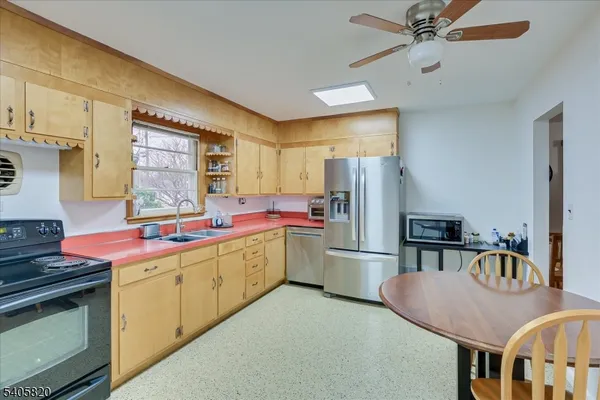 a bedroom with a large bed and a tv