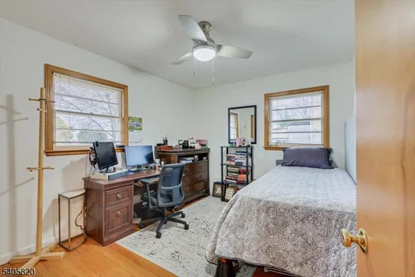 a bedroom with a bed and a chair