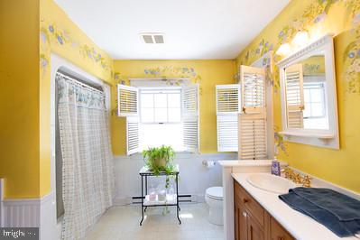 23130 Sparks Road Ridgely, MD 21660 - Photo 13 of 18 Bright and cheerful floral bathroom retreat.