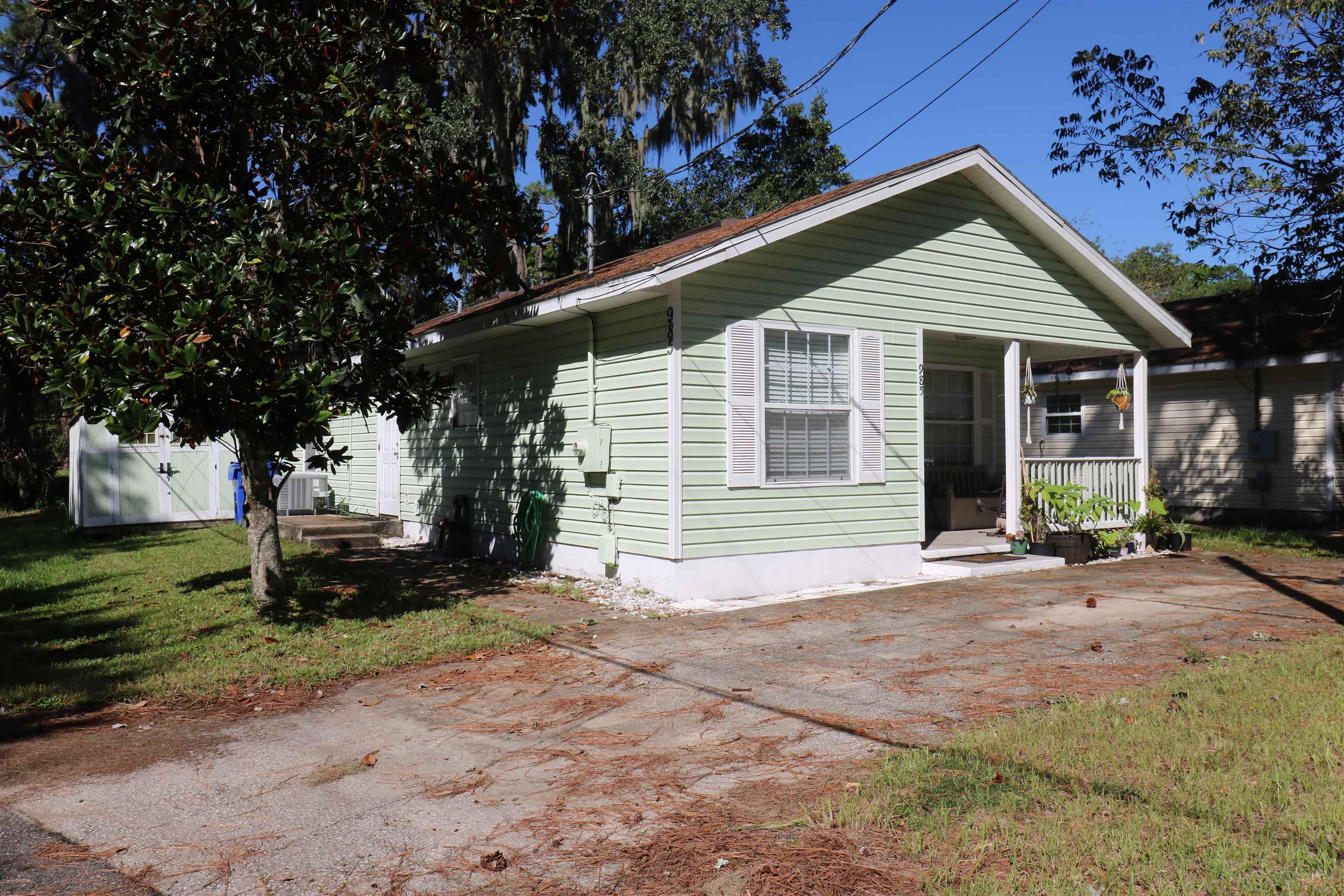 View of front facade with a front yard and a patio area
