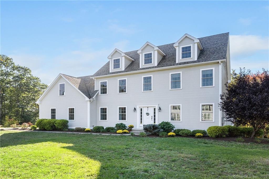 17 Wind Mill Lane Canton, CT 06019 - Photo 1 of 1 a view of a white house with a big yard and potted plants