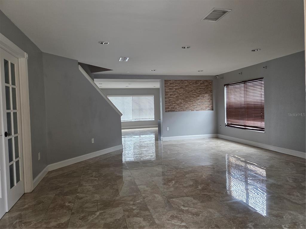 2728 Amanda Kay Way Kissimmee, FL 34744 - Photo 2 of 16 an empty room with windows and closet