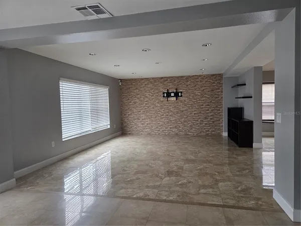 a view of an empty room with a window