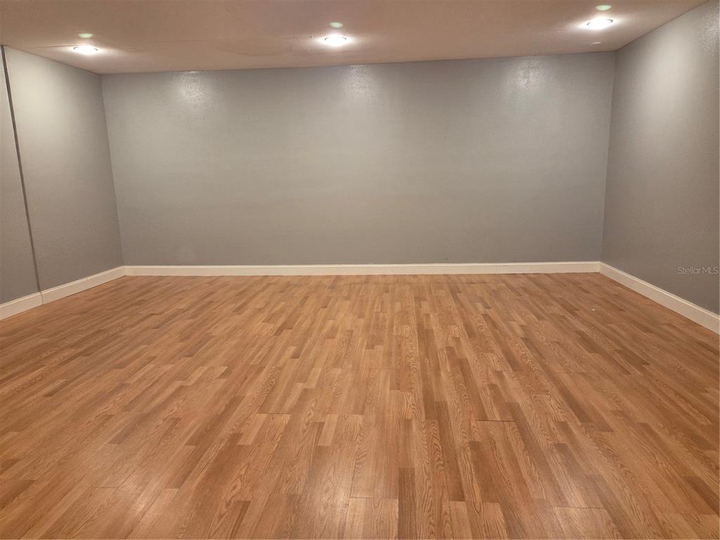 2728 Amanda Kay Way Kissimmee, FL 34744 - Photo 6 of 16 a view of empty room with wooden floor and fan