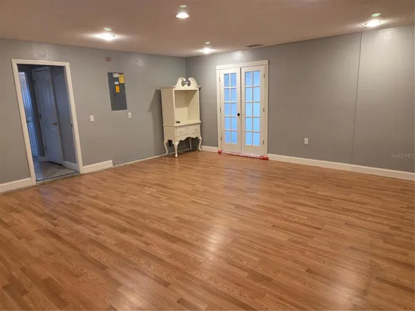 a view of a livingroom with wooden floor