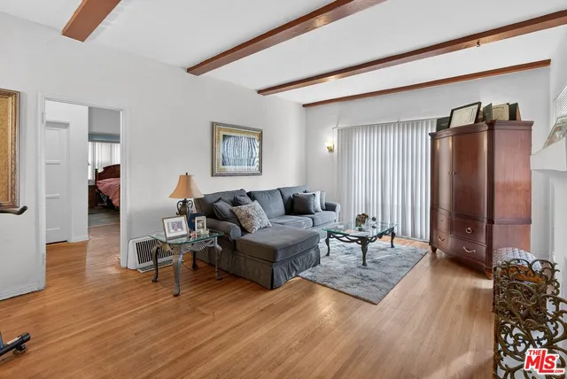 a view of a dining room with furniture wooden floor and chandelier