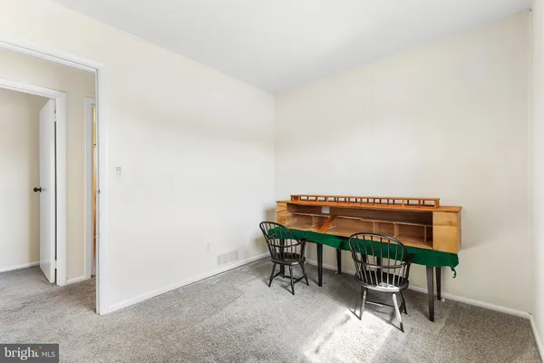 a room with a bunk bed and a chair