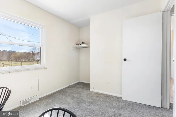 a view of a room that has a window in it