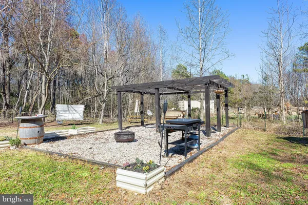 swimming pool view with a seating space