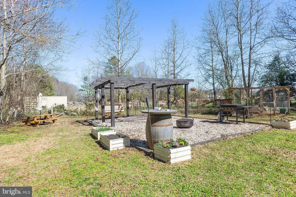 a view of a backyard with swimming pool
