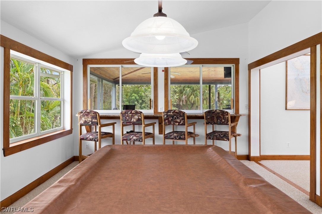17301 Frank Road Alva, FL 33920 - Photo 11 of 46 a dining room with furniture window and outside view