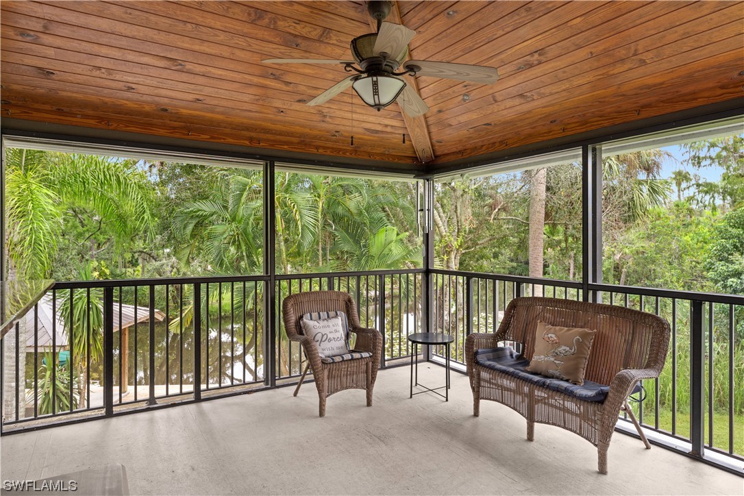 17301 Frank Road Alva, FL 33920 - Photo 15 of 46 a balcony with furniture and a window