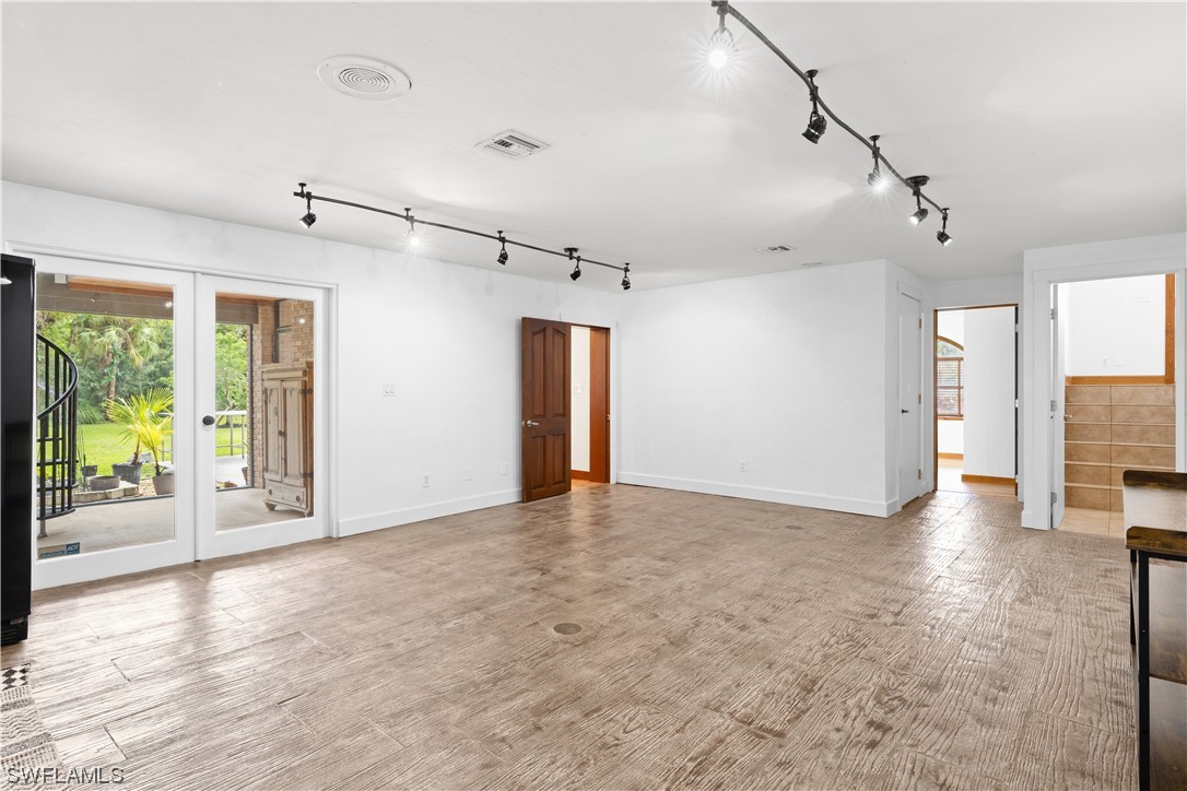 17301 Frank Road Alva, FL 33920 - Photo 21 of 46 a view of a livingroom with wooden floor