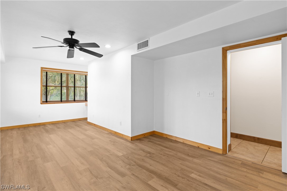 17301 Frank Road Alva, FL 33920 - Photo 25 of 46 wooden floor in an empty room with a window