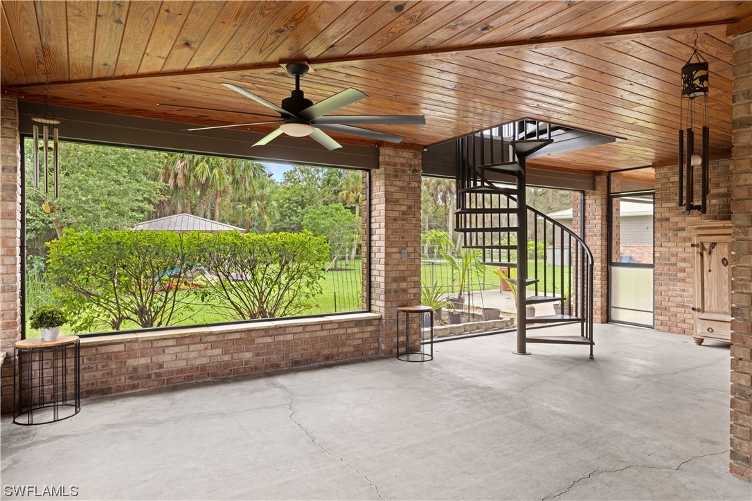 17301 Frank Road Alva, FL 33920 - Photo 29 of 46 a view of a porch with a table and chairs