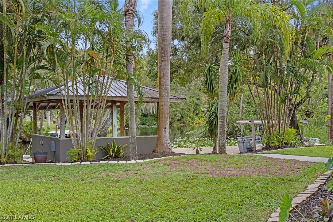 17301 Frank Road Alva, FL 33920 - Photo 36 of 46 front view of house with a garden