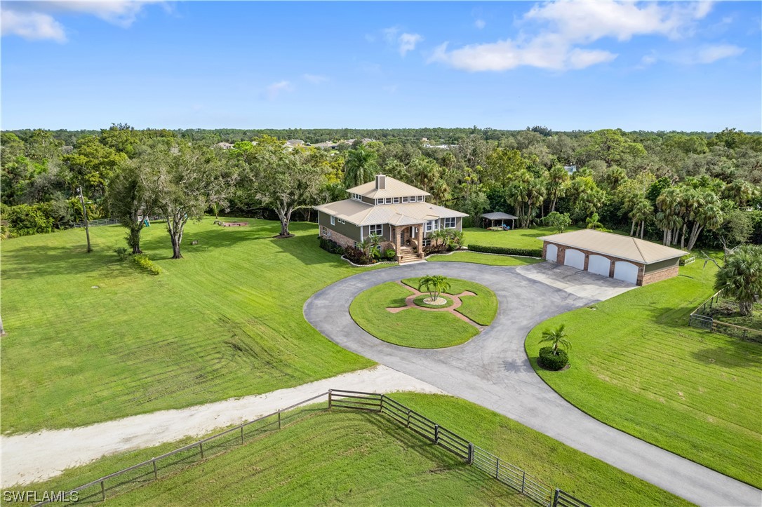17301 Frank Road Alva, FL 33920 - Photo 41 of 46 a view of a swimming pool and lounge chairs