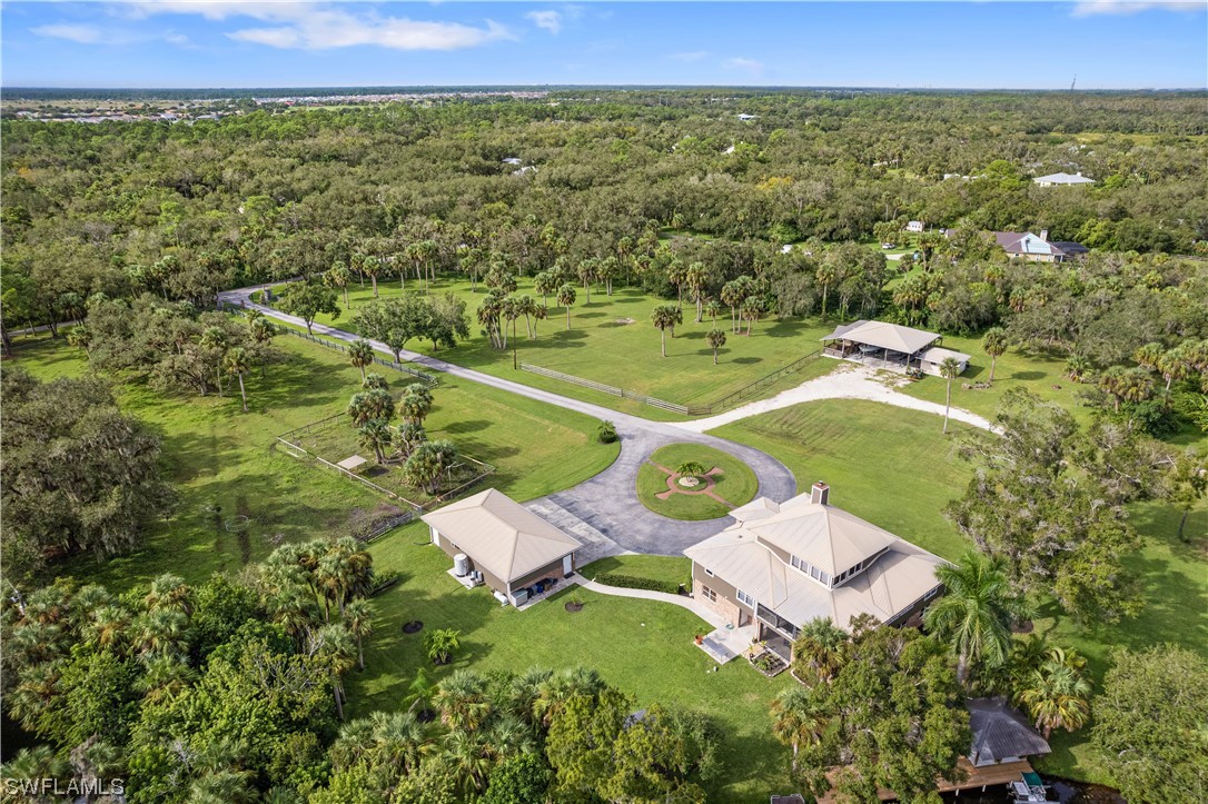 17301 Frank Road Alva, FL 33920 - Photo 42 of 46 a view of a lake with a yard
