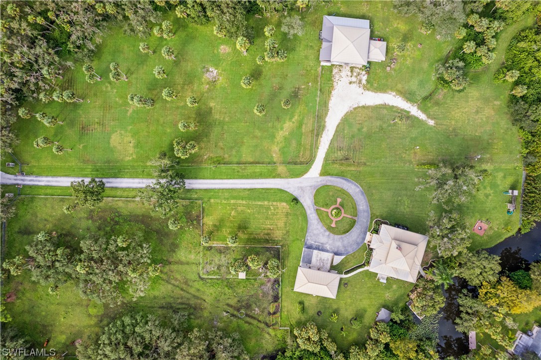 17301 Frank Road Alva, FL 33920 - Photo 44 of 46 an aerial view of residential house with outdoor space and swimming pool