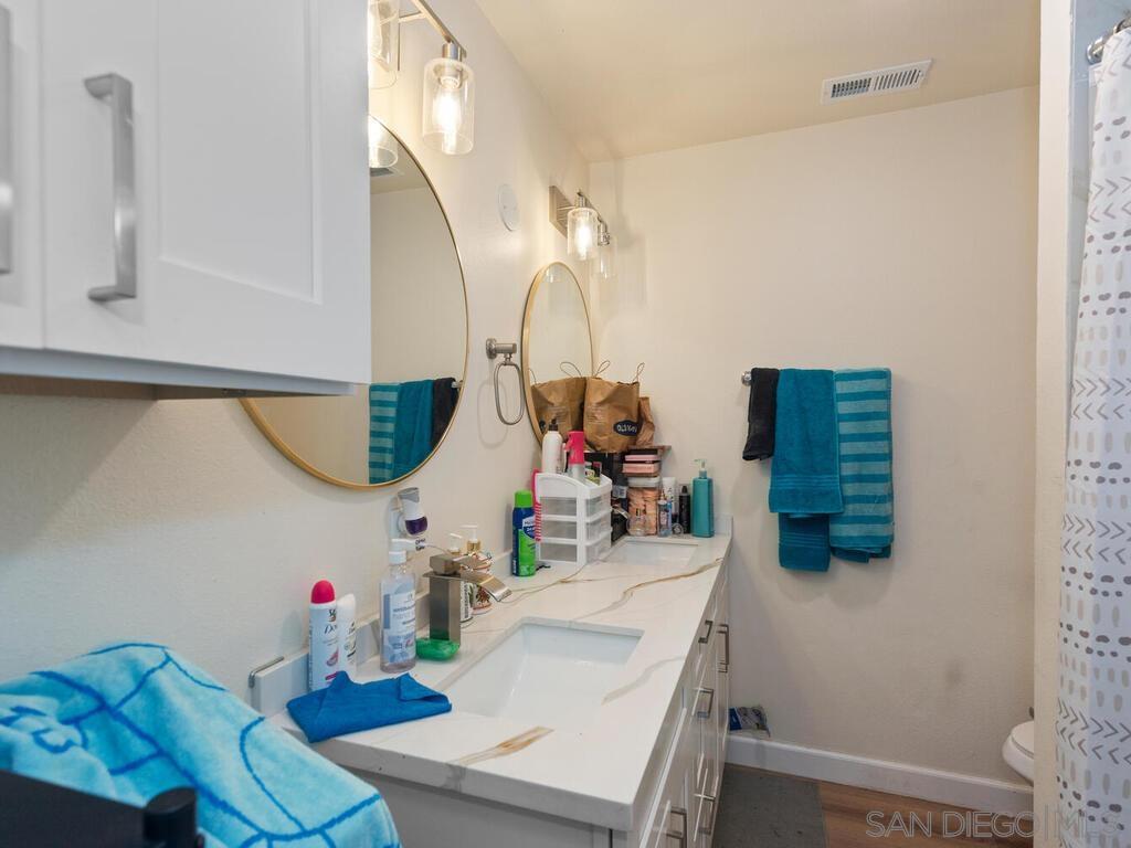 1019 Chestnut Street Escondido, CA 92025 - Photo 27 of 35 a bathroom with a sink mirror and toilet