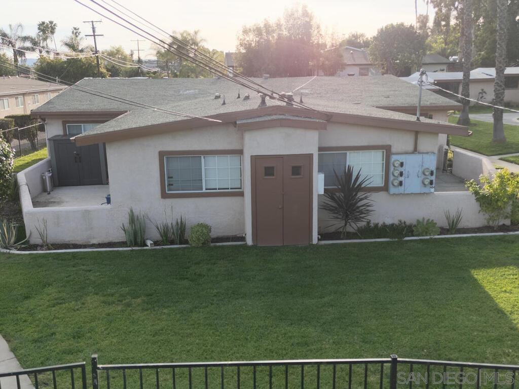 1019 Chestnut Street Escondido, CA 92025 - Photo 4 of 35 a front view of a house with a garden