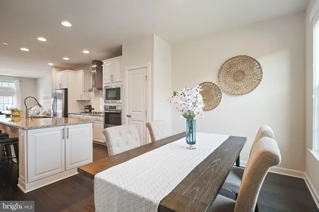 a very nice looking dining room with a table and chairs