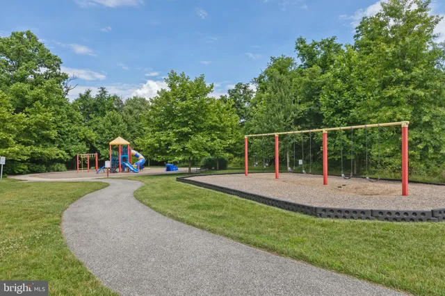 a view of a playground with basketball court