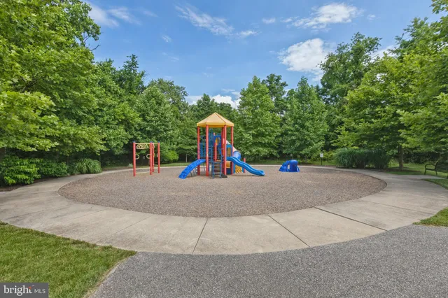 a childrens park with lots of trees