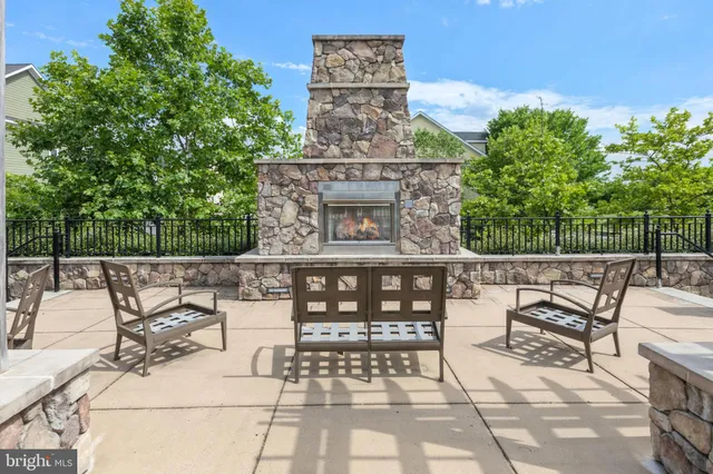 a view of a patio with table and chairs and potted plants