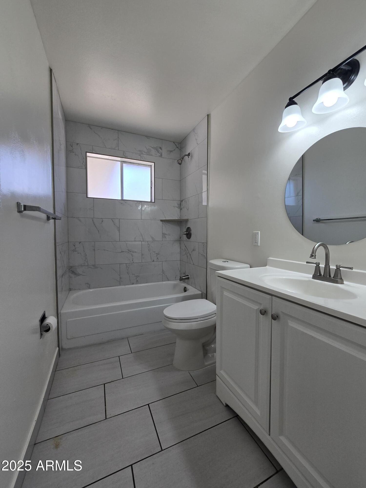2211 West Pecan Road Phoenix, AZ 85041 - Photo 13 of 21 a bathroom with a sink a toilet and shower