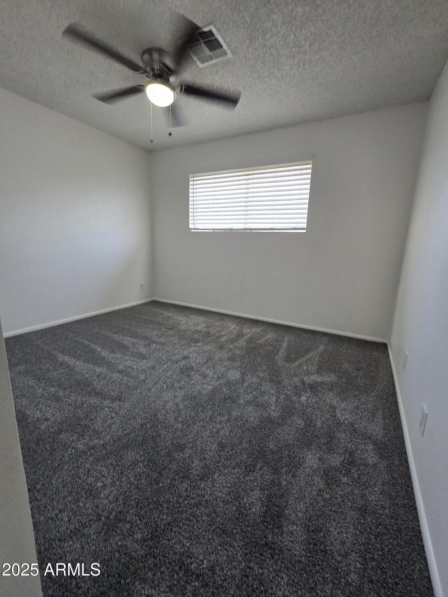 2211 West Pecan Road Phoenix, AZ 85041 - Photo 15 of 21 a view of an empty room and a window