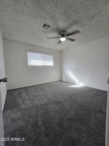 a bathroom with a toilet sink and shower