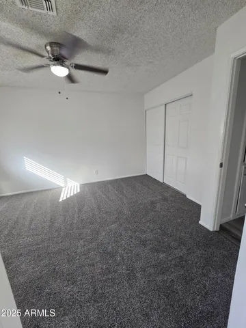a bathroom with a toilet sink and shower