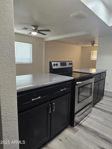 a kitchen with a stove and a microwave