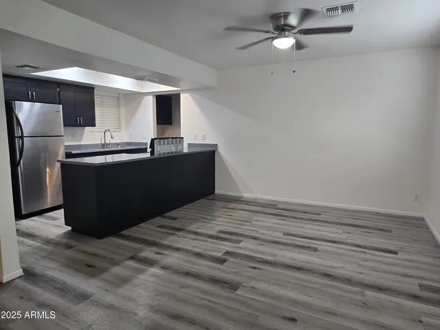 a view of kitchen with wooden floor