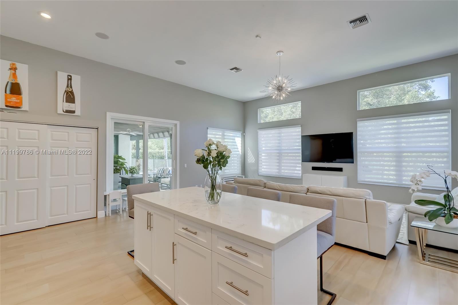 9901 North Abiaca Circle Davie, FL 33328 - Photo 14 of 46 a spacious en suite bathroom with a granite countertop tub and a sink